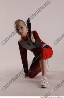 DENISA KNEELING POSE WITH GUN